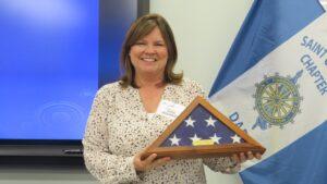 Member holding American flag